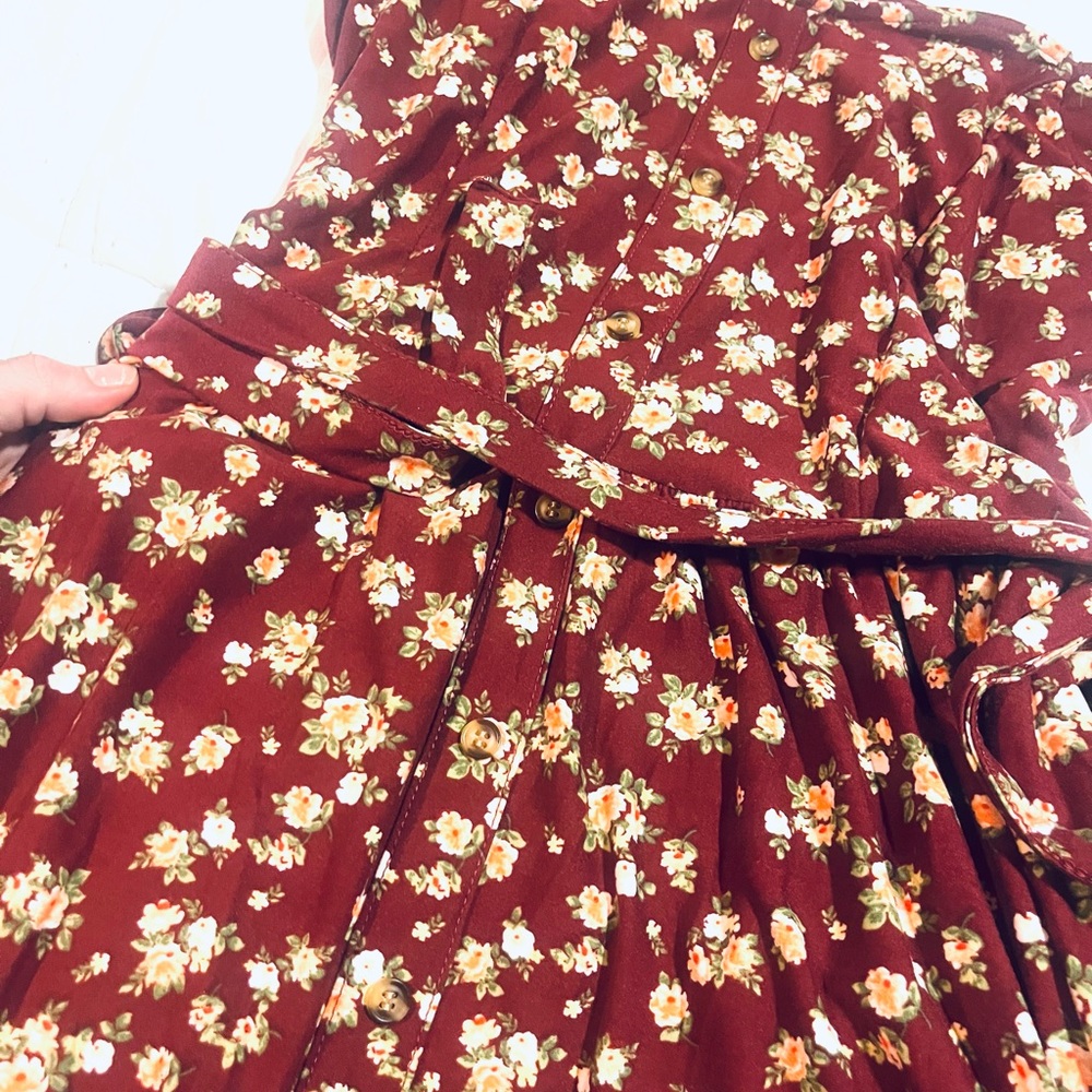 L. Soft mid length burgundy dress with flower detail